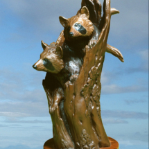 Watching the Neighbors $2,495 23"H X 6"W bronze sculpture, casting, wildlife sculpture, figurine piece, raccoons, hollow tree clark bronson